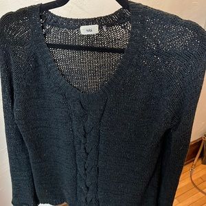 Black lightweight sweater with bell sleeves and cable detail